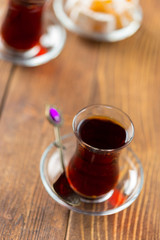 Red tea in turkish glasses on a wooden table