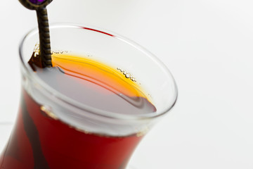 Turkish tea in traditional glass isolated on white background