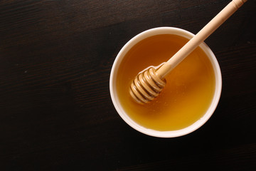 Honey on a wooden background