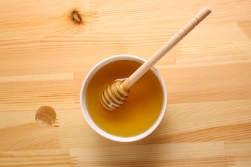 Honey on a wooden background