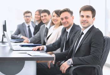 project Manager and professional business team sitting at Desk