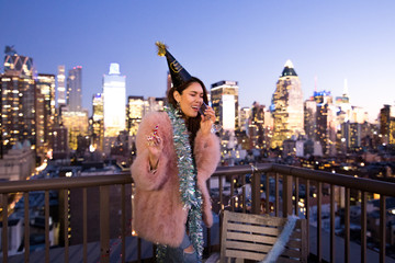 Obraz na płótnie Canvas A woman having fun party on the rooftop