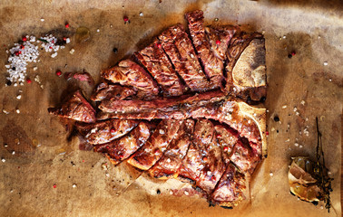 t bone steak grill, cut into pieces