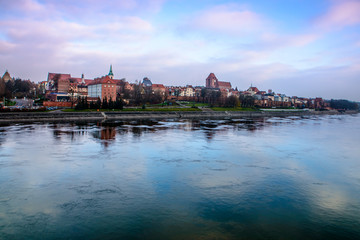Fototapeta na wymiar Torun, Panorama view from opposide bank of Vistula river, one of the most beautiful cities in Poland 