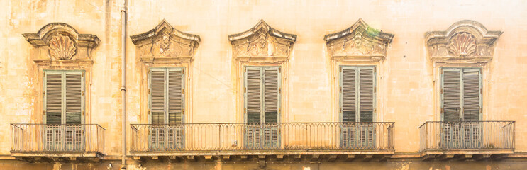 Fototapeta na wymiar Lecce, Italy - Old windows in baroque style