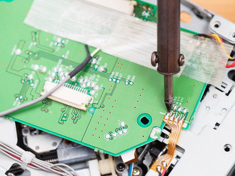 electric circuit board repair with soldering iron