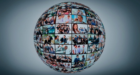 A globe is isolated on a white background with many different business people