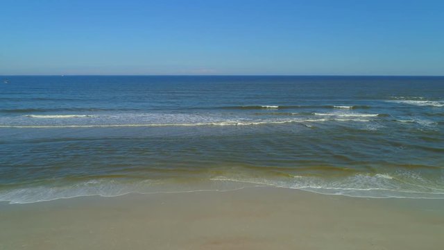 Aerial sand shore ocean transition video