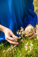 a woman tearing flowers
