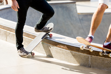 Fototapeta na wymiar Teenage boy skateboarding outdoors