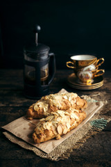 Fresh baked croissant with almonds slices served with coffee,selective focus