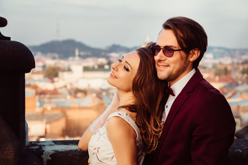 The young couple are admiring the view that opens from the balco