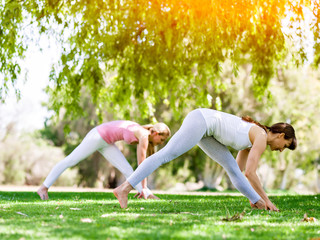 Fototapeta premium Young women exercising in the park