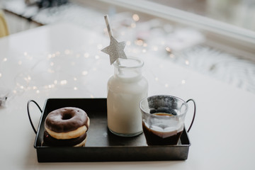 Donuts and milk in a botlle