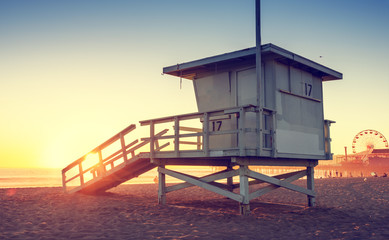 Naklejka premium Santa Monica beach lifeguard tower in California USA at sunset