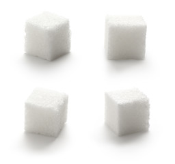 Collection of sugar cubes on white background