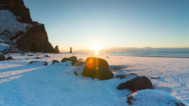Time lapse of famous Black beach in Iceland with beautiful sunrise light
