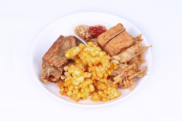 Deep fried dessert of sweet corn,tofu ,taro and  spring roll served with spicy sweet sauce.