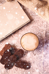 hot cappuccino. empty notepad. feast on holidays. snow