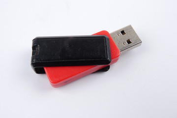Black and red flash drive isolated on white background.