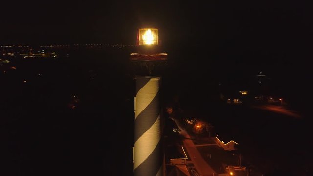 Aerial night orbit St Augustine historical lighthouse 4k 24p
