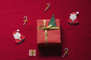 Flat Lay Christmas Gift Box on Red Background.
