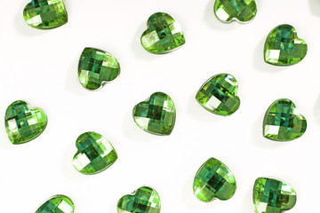 Green Rhinestone background. Heart shape texture as backdrop isolated white studio photo. Bling rhinestone crystal pattern. Rhinestones crystals as background. green.