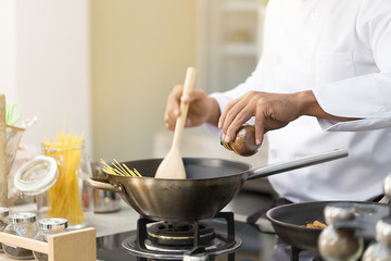 Chef making and cooking Spaghetti