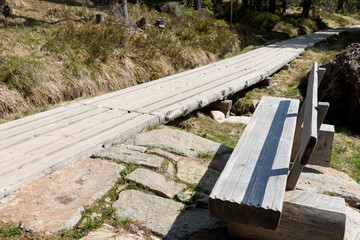 Fototapeta na wymiar Wooden boardwalk in the National park Krkonose Giant mountains, Czech Republic
