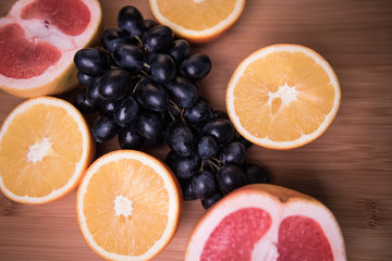 Fototapeta na wymiar Assorted fruits on a gray background