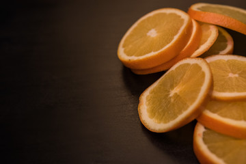 orange sliced on wood background dark tone with space for text