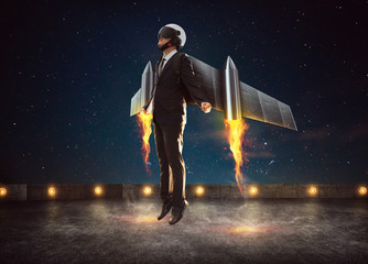 Businessman wear a rocket suit to lift , Business success concept .