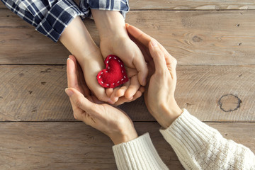 Red heart in hands