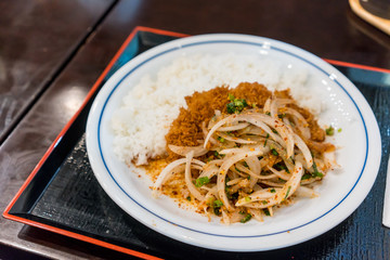 Thai Larb menu fusion on Tonkatsu served with steamed rice on tray.