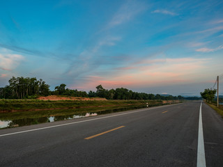 Fototapeta premium the road beside river in the morning