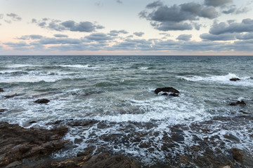 Rocky seaside, during the wind and storm. Volcanic, Ocean coastline.