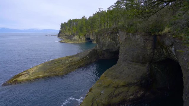 Incredible landscape of the coast. Beautiful blue sea. The waves rolled ashore and breaking on the rocks. Olympic Peninsula, Cape flattery trail. 4K, 3840*2160, high bit rate, UHD