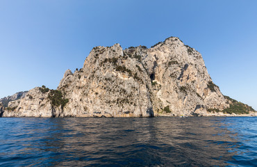 The Island of Capri is a very picturesque, luxuriant and extraordinary location in Italy famous for its high rocks.
