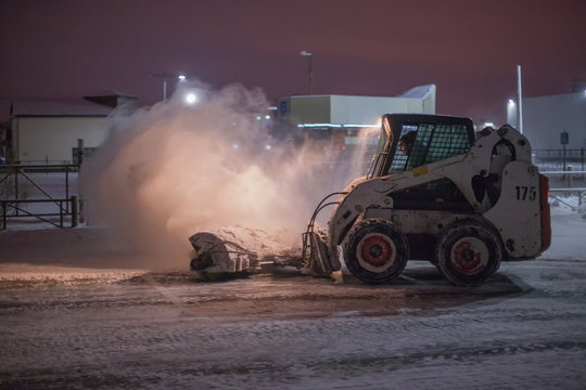 Snowplow clearing road