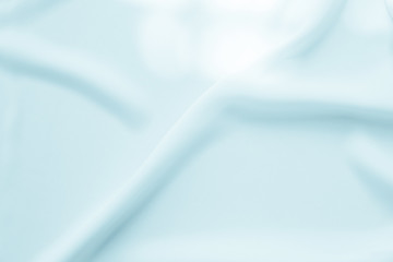 Abstract wave pattern on blue fabric texture background