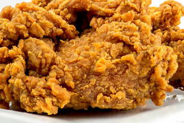 Extreme closeup golden spicy fried chicken