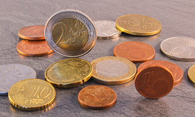 Euro coin with slovakia crown on stone background