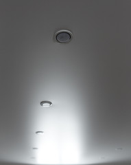 lamps on a stretch ceiling in a room