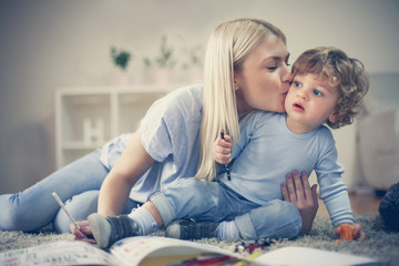 Mother share love with her son have playing together.