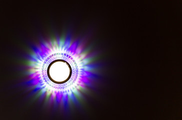 a lamp on a stretch ceiling in a room