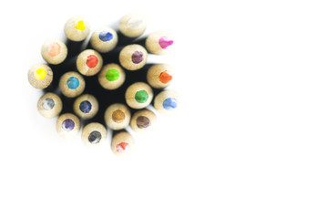 Top view of colored pencils isolated on white.