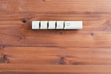2018 enter on computer keyboard keys on a wooden background. New year 2018 card