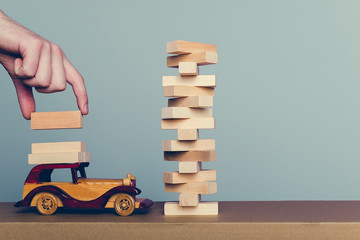 Wooden puzzles load on a retro car