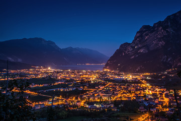 View of the beautiful Lake Garda .Riva del Garda town and Garda lake by night, Italy - obrazy, fototapety, plakaty