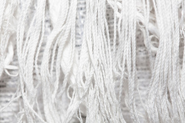 white canvas texture background with filament. close up